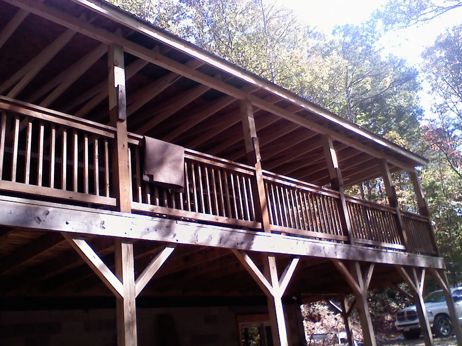 Timber framing under a new elevated porch and deck — Roof Leak Repair in Wixom by Roofing Brothers